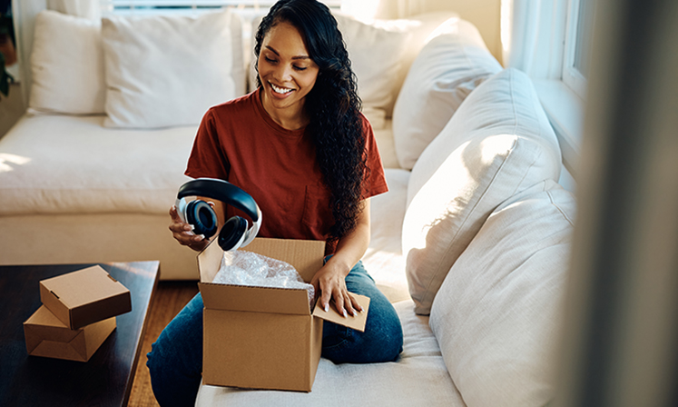 woman packaging a personal item for delivery